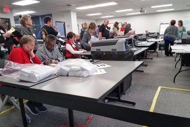 Counting absentee ballots, Waukesha, WI