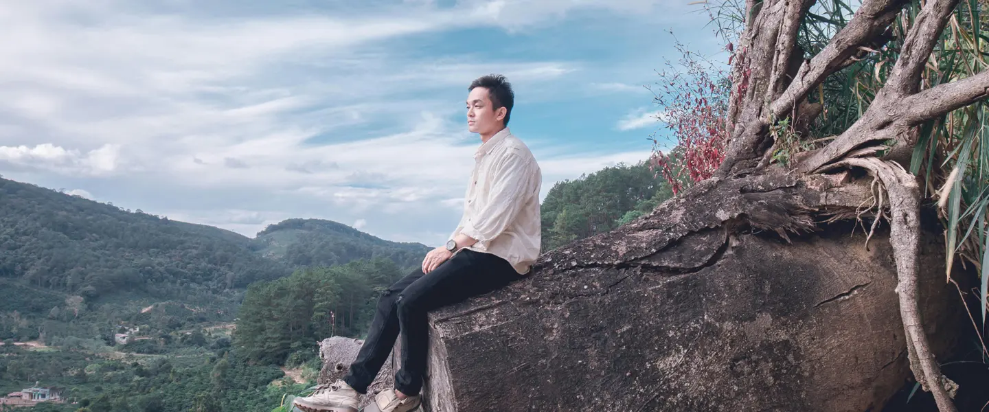 man, alone, sitting on stump