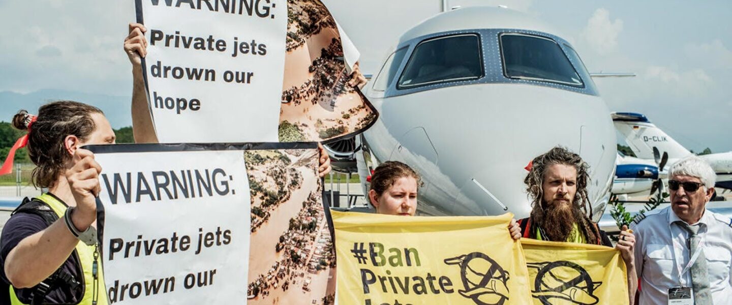 Activists, peacefully occupying, protest, private jets