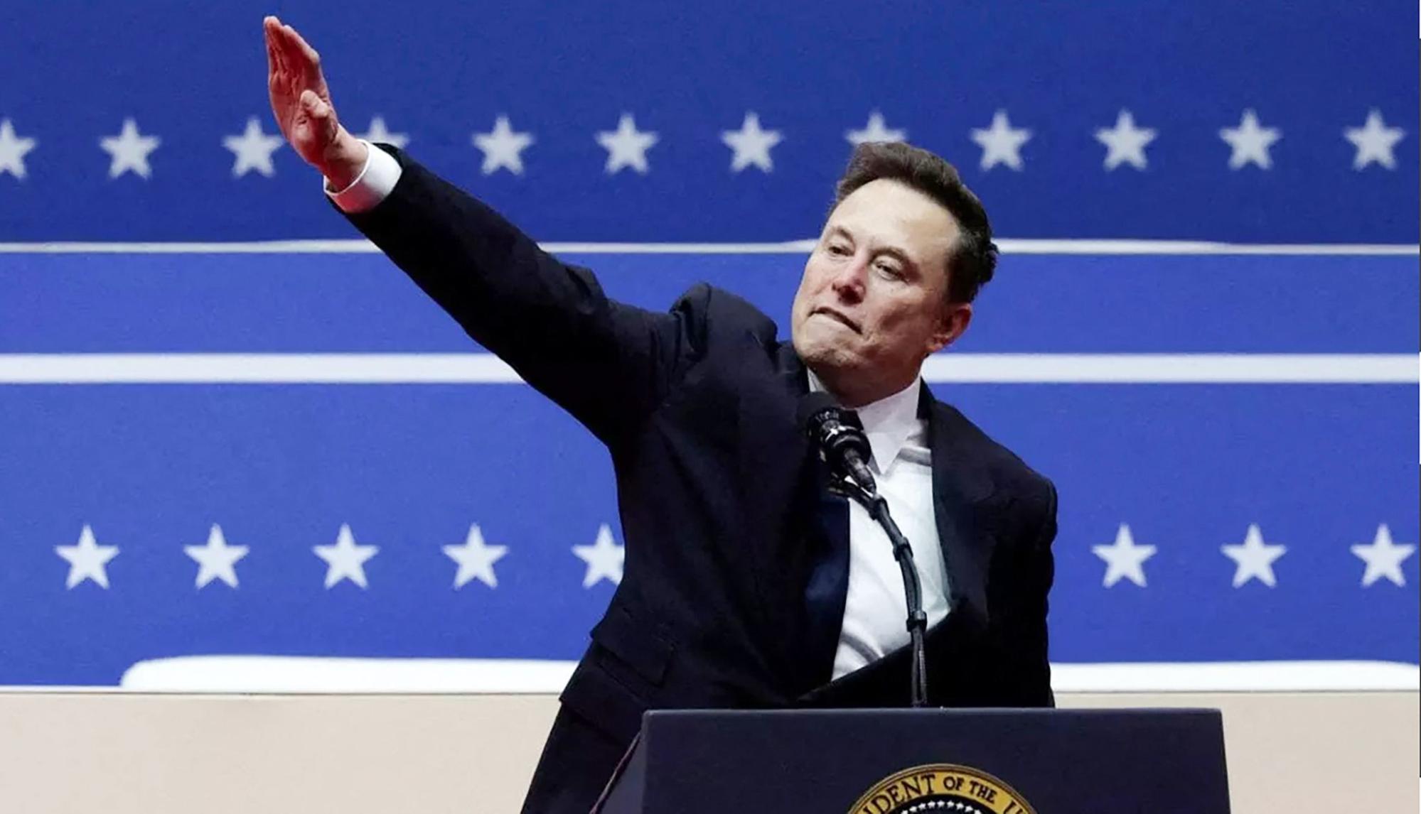 Elon Musk makes Nazi salute.