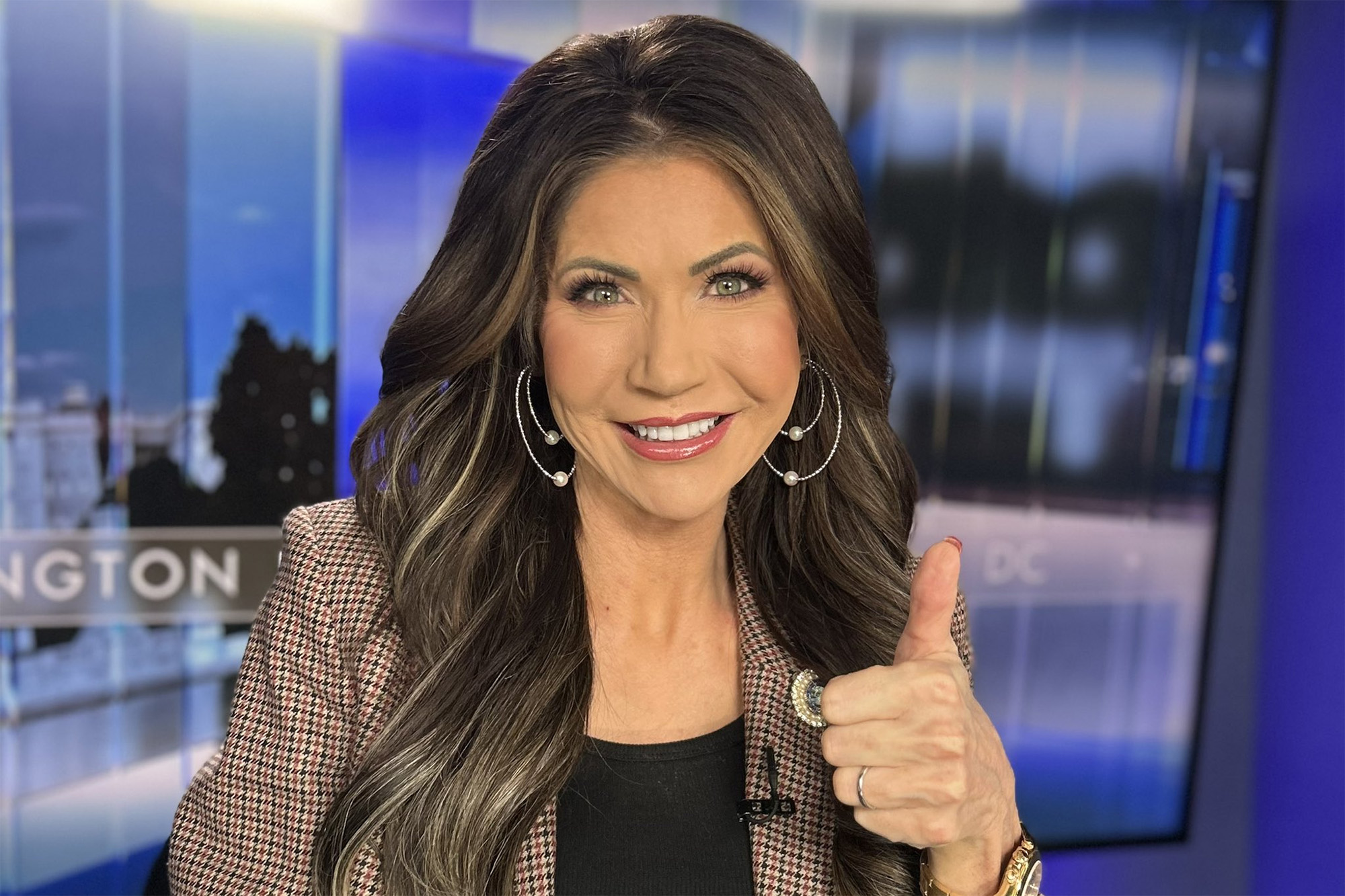 Kristi Noem, performing a thumbs up, Homeland Security Secretary