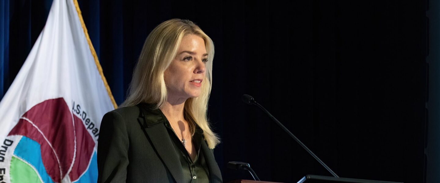 Pam Bondi, podium, speaking