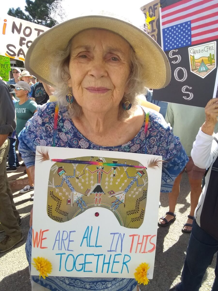 Woman, sign, We are all in this together