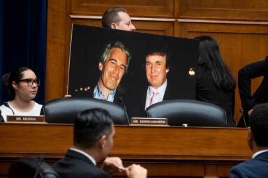 Jared Moskowitz, holds, Trump Epstein Poster