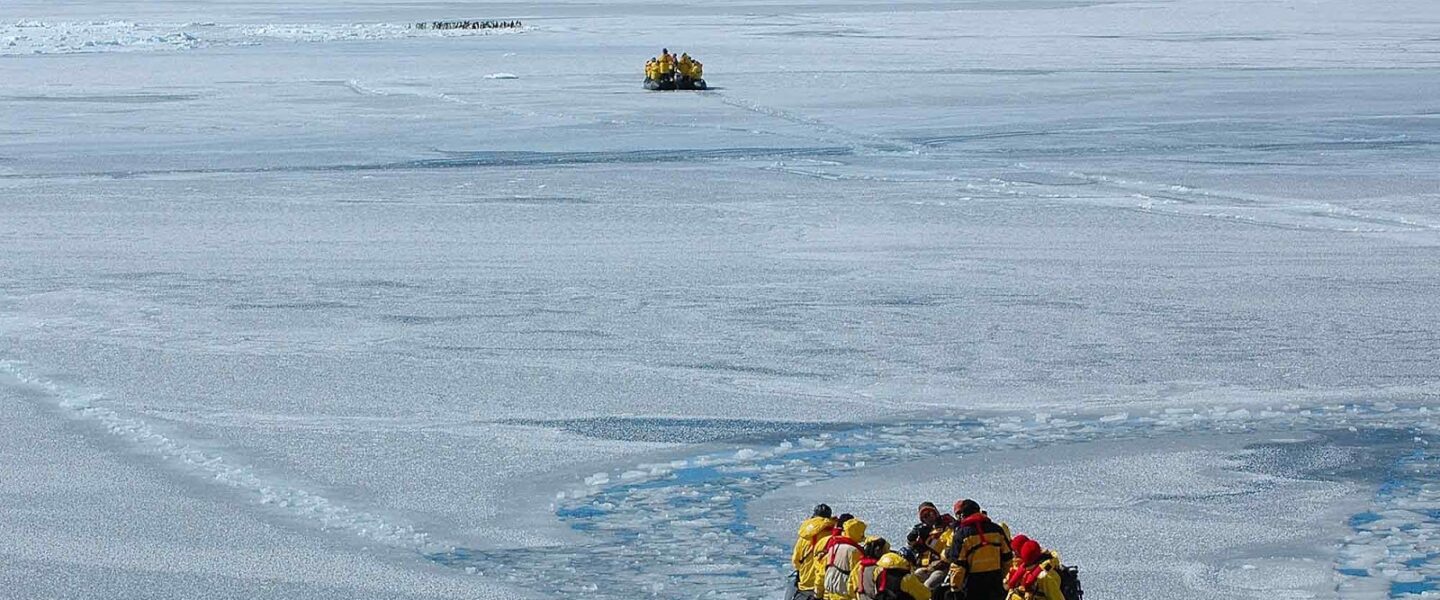 Explorers, zodiacs, sea ice, Snow Hill, Antarctica