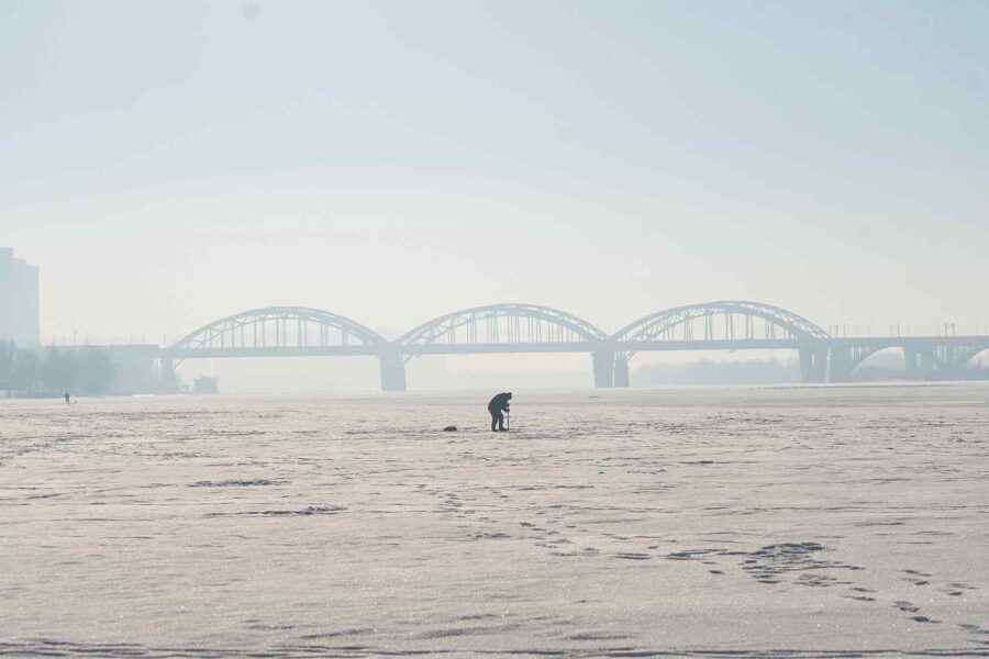 ice fisherman, break ice, metal spike, Kyiv, Ukraine