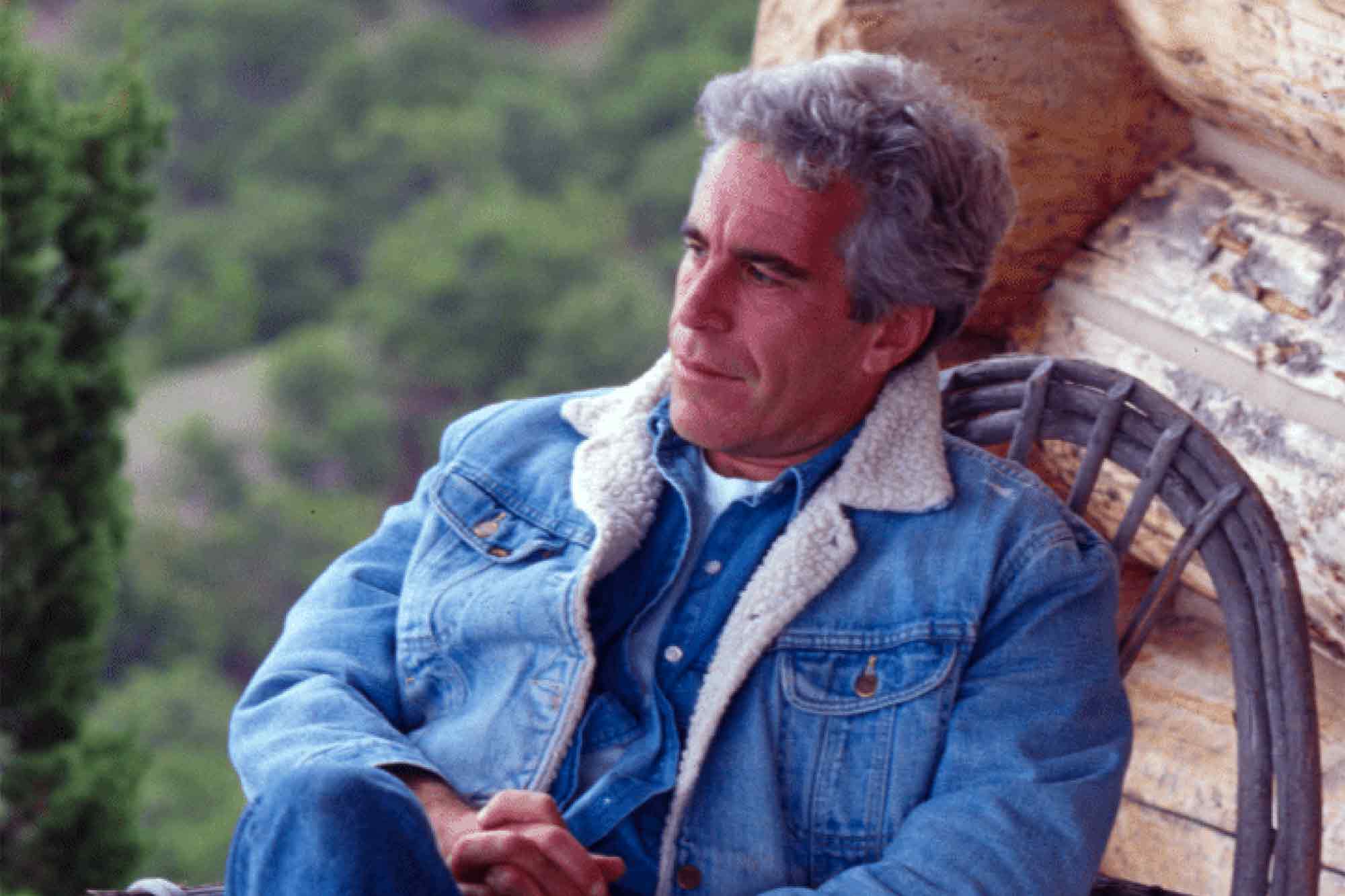 Jeffrey Epstein, sitting, wicker chair