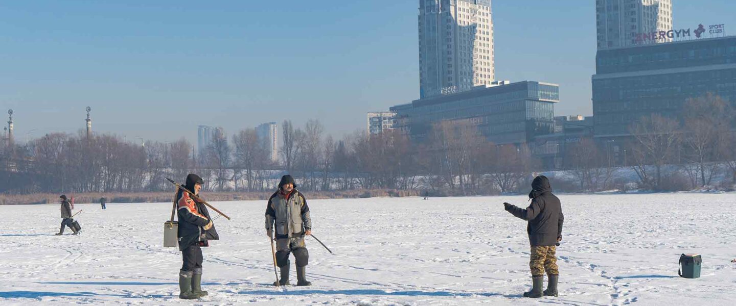 Three ice fishermen, frozen, Dnipro River, Kyiv