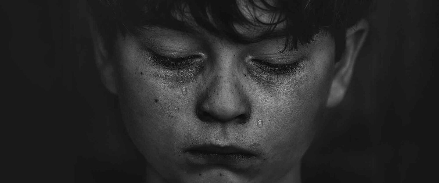 Grieving, adolescent, boy, tears