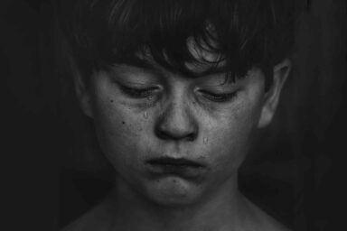 Grieving, adolescent, boy, tears