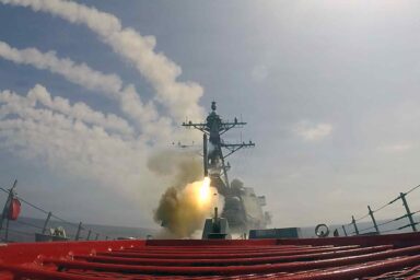 Arleigh Burke-class guided-missile destroyer fires missiles during Operation Epic Fury, USS Frank E. Petersen Jr.